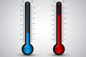 Thermometers displaying cold blue liquid on the left and hot red liquid on the right, illustrating temperature variations relevant to home heating tips.